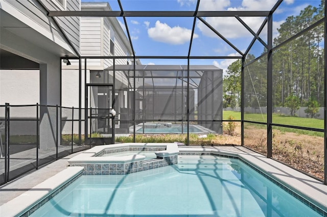 view of swimming pool with glass enclosure and an in ground hot tub