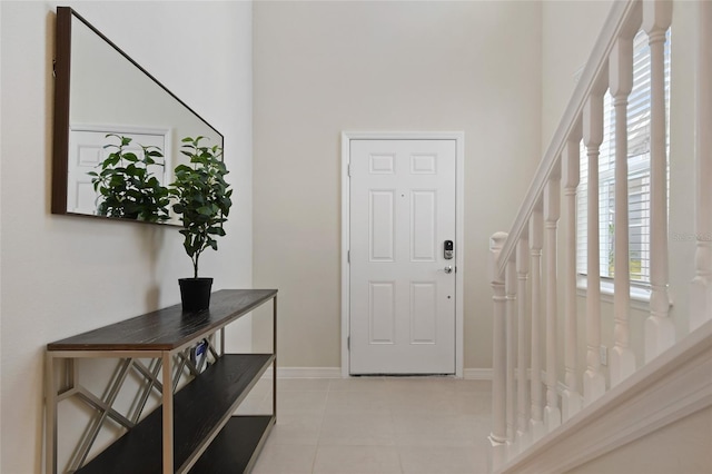 tiled entryway featuring a healthy amount of sunlight