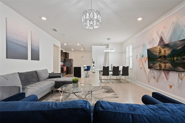 tiled living room featuring a chandelier