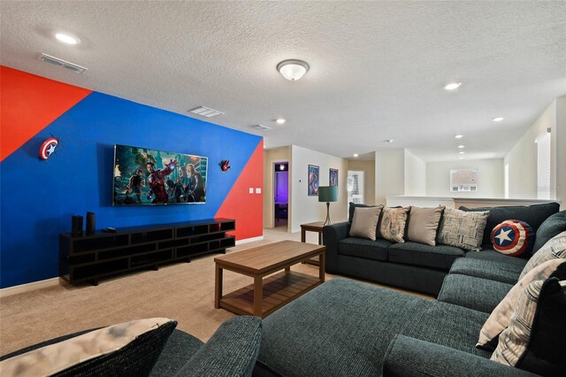 carpeted living room with a textured ceiling