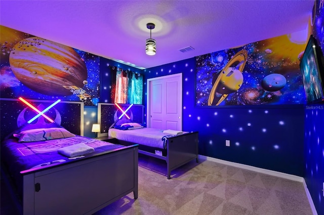 unfurnished bedroom featuring carpet and a textured ceiling