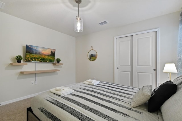 carpeted bedroom featuring a closet