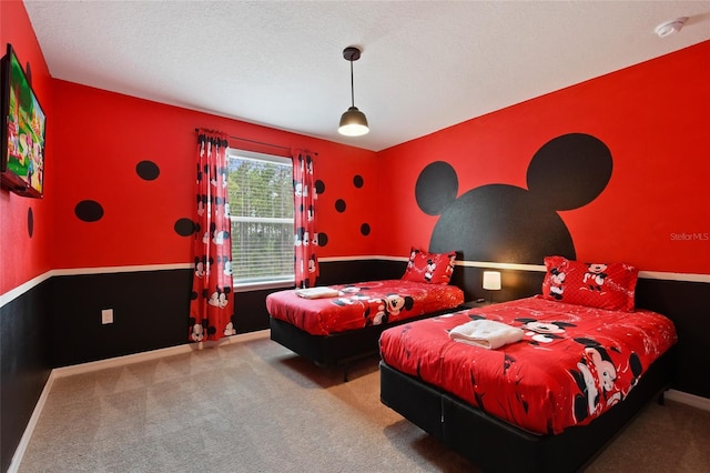 carpeted bedroom featuring a textured ceiling