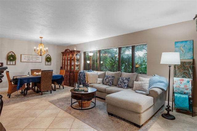 living room featuring a chandelier and light tile patterned flooring