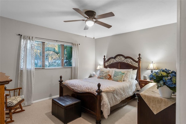 bedroom featuring ceiling fan and light carpet