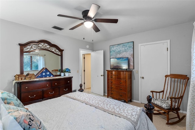 bedroom featuring ceiling fan and light carpet