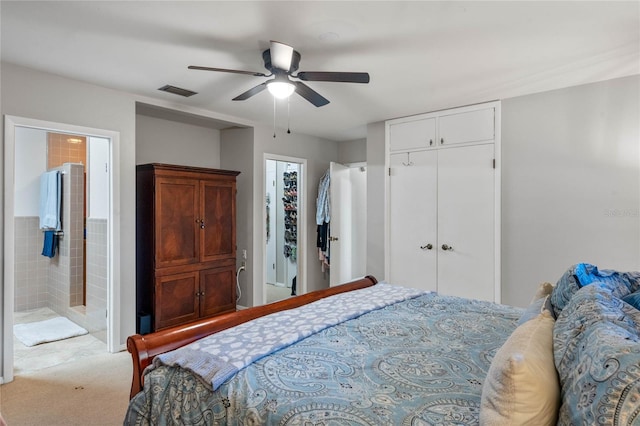 carpeted bedroom with connected bathroom and ceiling fan