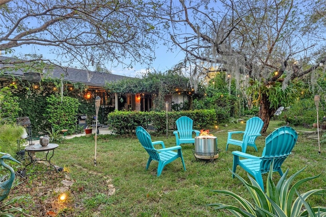 view of yard with an outdoor fire pit