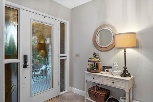 doorway to outside featuring light tile patterned floors