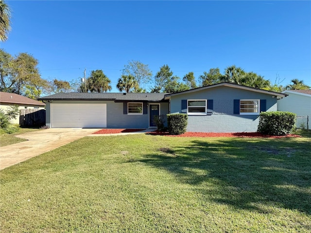 ranch-style home with a front yard and a garage