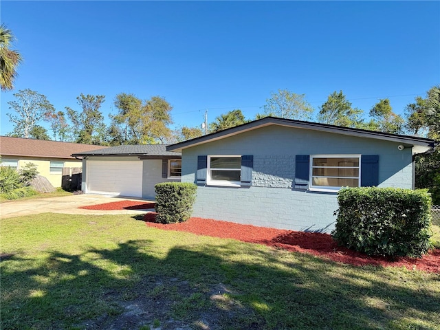 single story home with a garage and a front yard