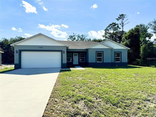 single story home featuring a front yard and a garage