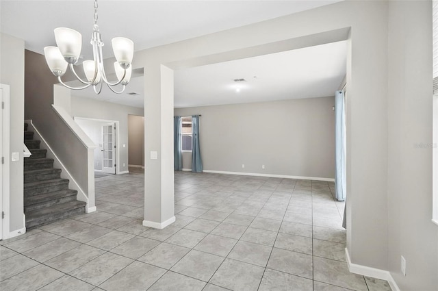 interior space featuring light tile patterned flooring and an inviting chandelier