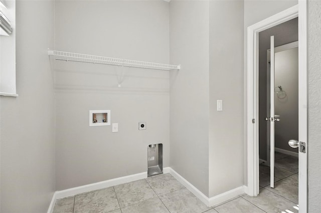 laundry room featuring hookup for an electric dryer, hookup for a washing machine, and light tile patterned floors