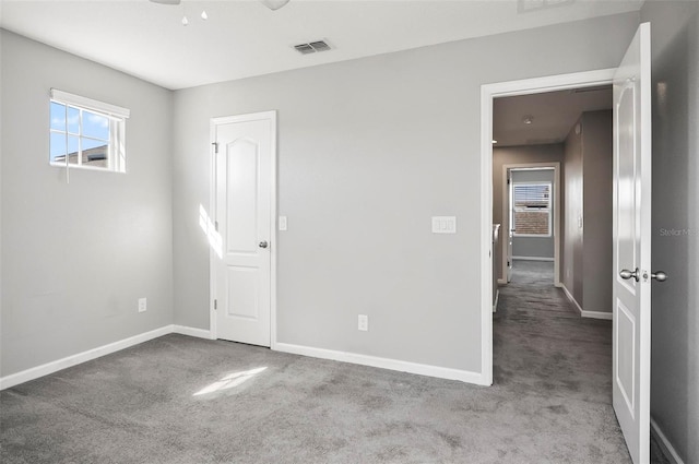 unfurnished bedroom featuring light colored carpet