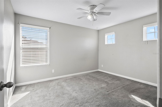 carpeted empty room featuring ceiling fan