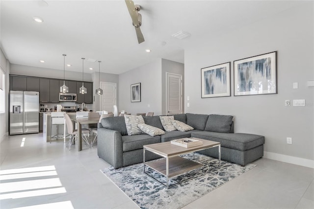 tiled living room featuring ceiling fan