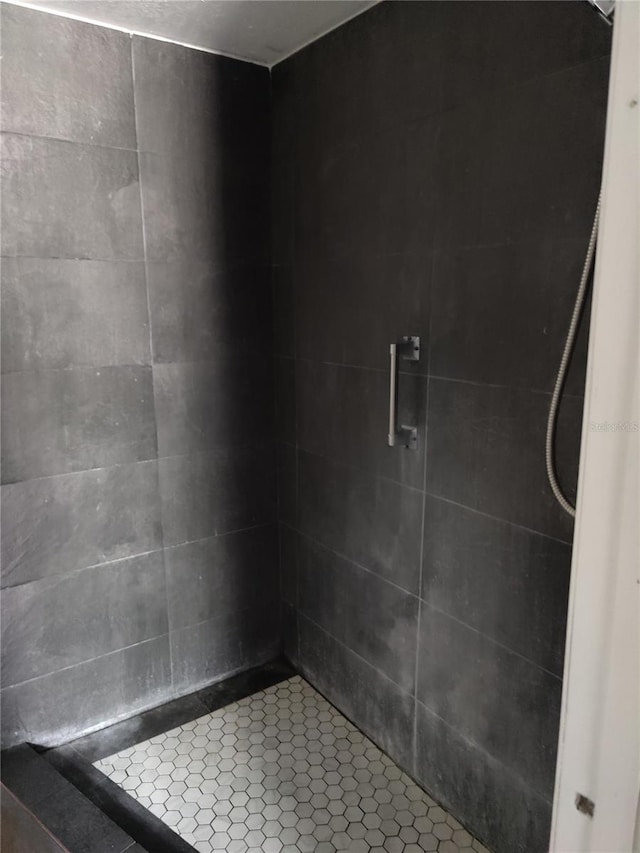 bathroom with a tile shower