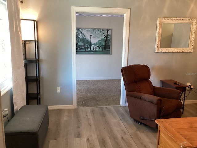 sitting room with light hardwood / wood-style flooring