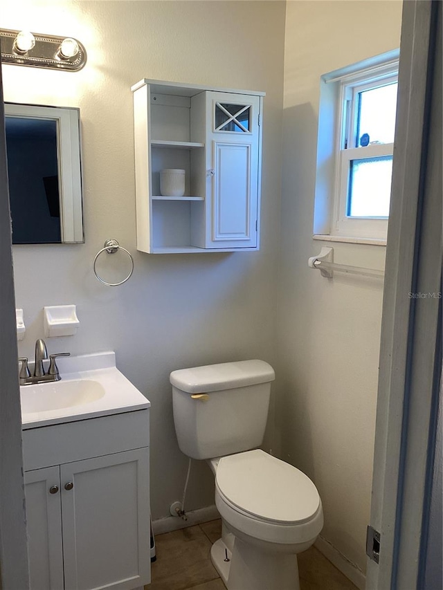 bathroom with vanity and toilet