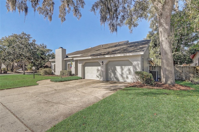 view of front of house featuring a garage and a front lawn