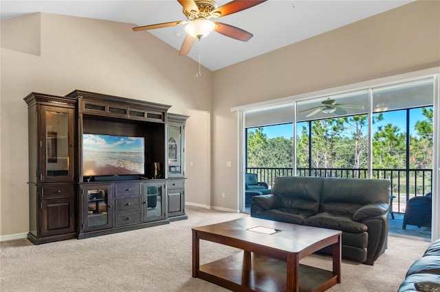 carpeted living room with vaulted ceiling and ceiling fan