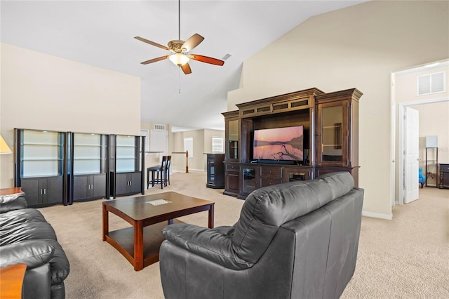 carpeted living room featuring ceiling fan and high vaulted ceiling