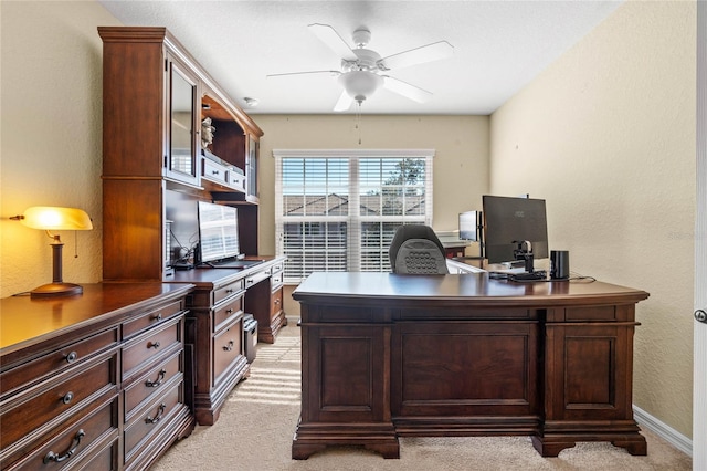 office area featuring ceiling fan and light colored carpet