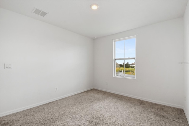 unfurnished room featuring carpet flooring