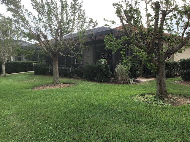 view of yard featuring a lanai