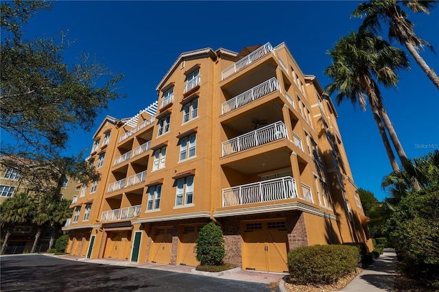 7500 Toscana Blvd Unit 341, Orlando, FL 32819 - view of apartment building / complex featuring a garage
