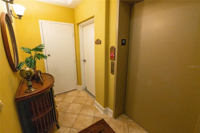 7500 Toscana Blvd Unit 341, Orlando, FL 32819 - corridor featuring elevator and light tile patterned floors