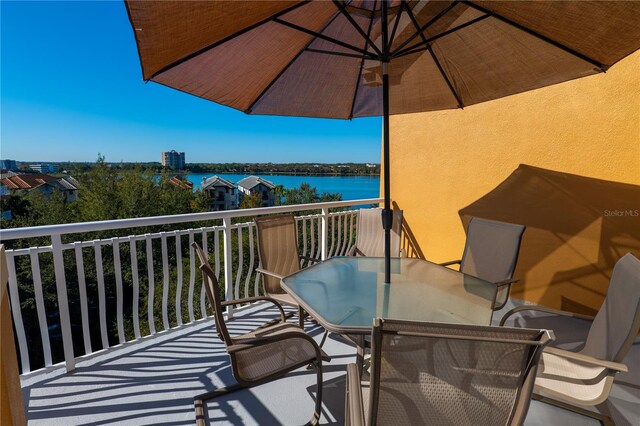 balcony featuring a water view