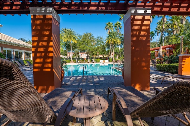 7500 Toscana Blvd Unit 341, Orlando, FL 32819 - community pool featuring a pergola and a patio area