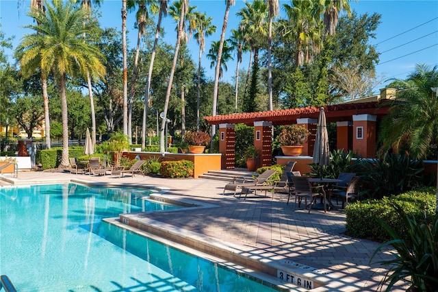 7500 Toscana Blvd Unit 341, Orlando, FL 32819 - community pool featuring a patio
