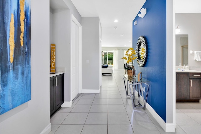 hallway featuring light tile patterned floors