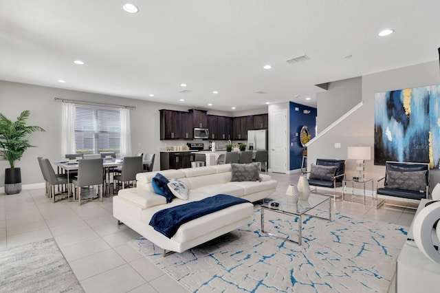 living room with light tile patterned flooring