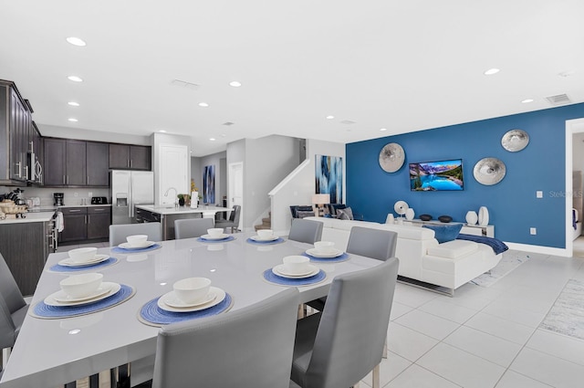 dining area featuring light tile patterned floors