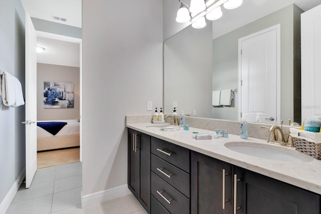 bathroom featuring tile patterned flooring and vanity