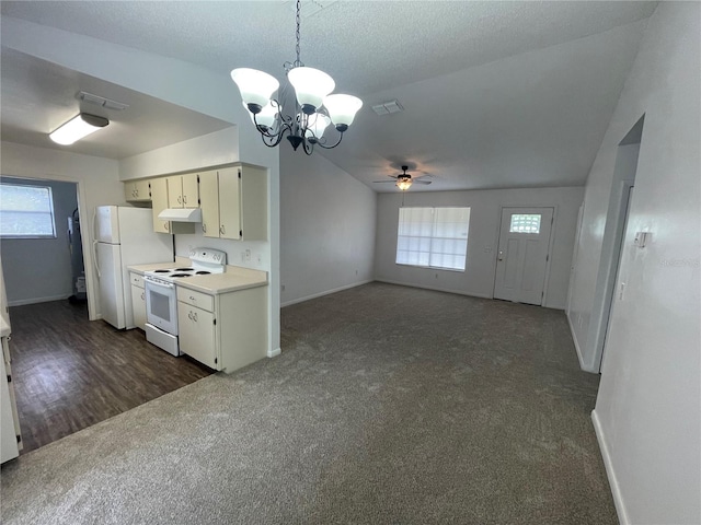 kitchen featuring ceiling fan with notable chandelier, white appliances, dark hardwood / wood-style floors, and a healthy amount of sunlight