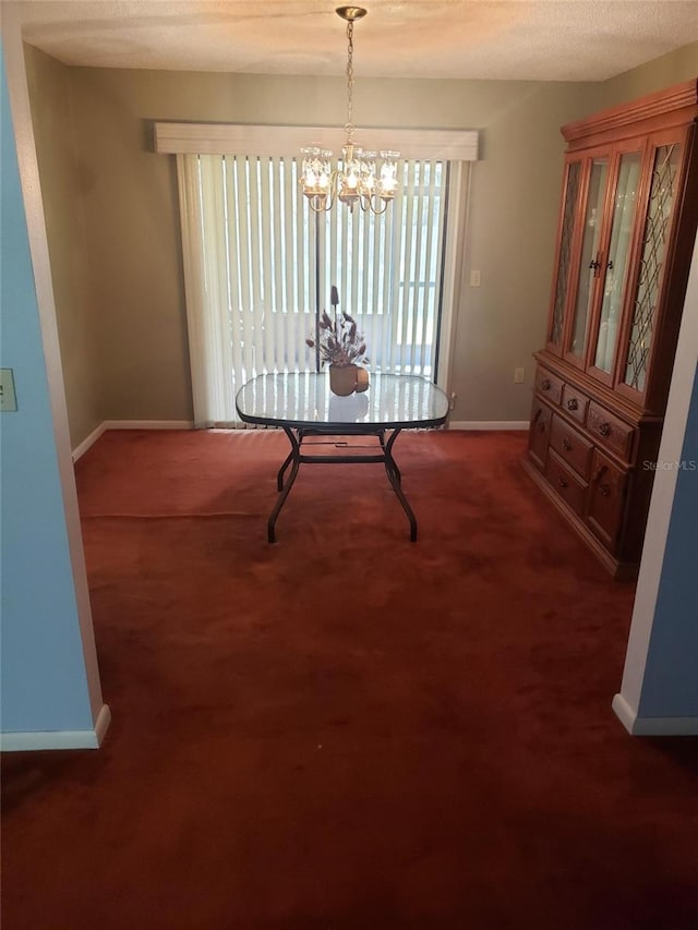 carpeted dining space with a chandelier