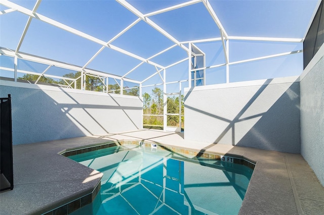 view of pool featuring a patio area and a lanai