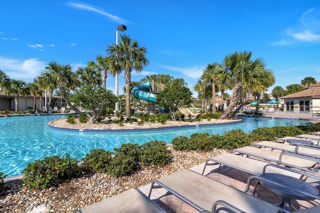 view of pool with a water slide