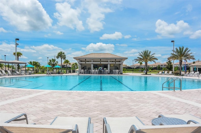 view of swimming pool featuring a patio