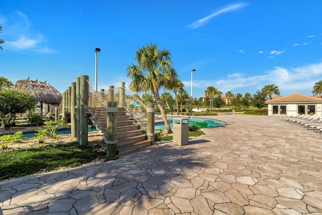 8943 Cabot Cliffs Dr, Davenport, FL 33896 - view of home's community featuring a pool and a patio
