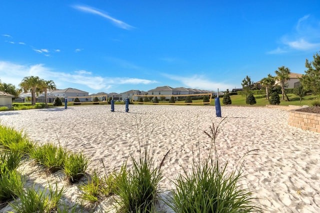 view of home's community featuring volleyball court