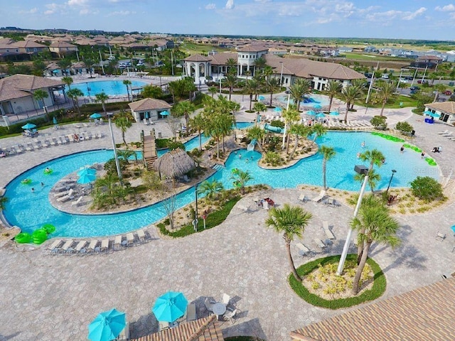 aerial view of residential area featuring a pool