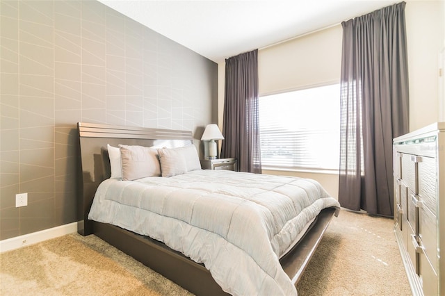 bedroom with carpet floors and baseboards