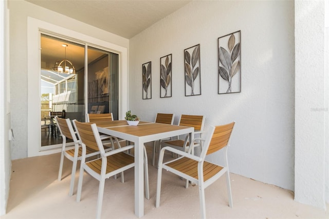 dining space featuring a chandelier