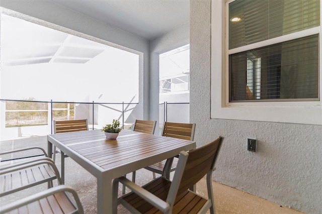 balcony with outdoor dining area